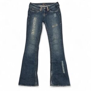 Bebe Rhinestone Low rise flare jeans with distressed details